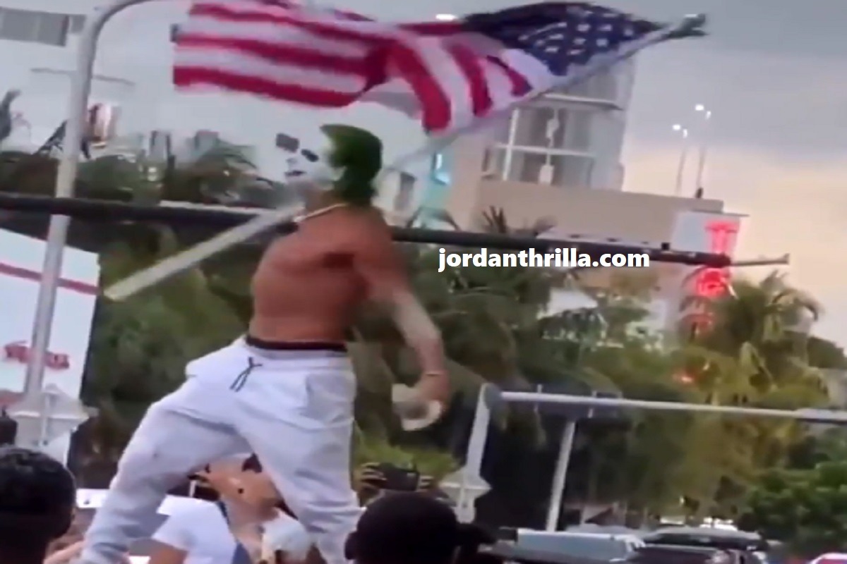 Man Dressed a Sting or Joker Yells "COVID is Over" at Miami Beach Spring Break While Standing On Cars