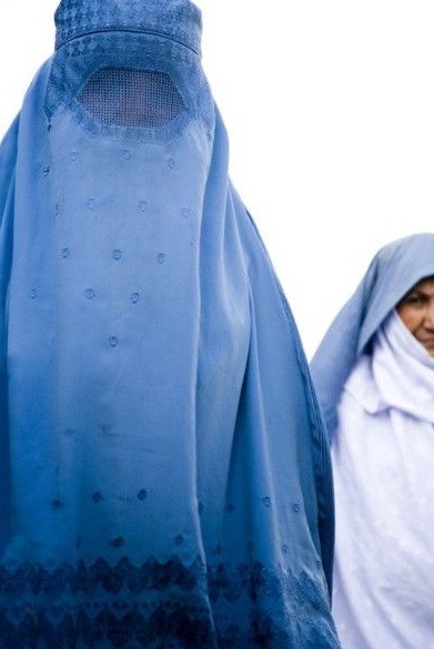 Viral Video Shows Taliban Leaders Laughing at News Reporter Asking If Afghan Women Can Vote or Be Elected into Office Under Their Rule. Taliban leaders laugh at Vice News Reporter asking about women's rights. Woman wearing burka under Taliban Sharia Law Rule in Afghanistan