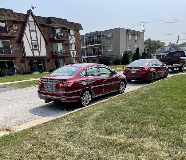 Throw Dat A** N'A Circle? Lil June Tacky Nissan Sentra With Camo Strips and 'Throw Dat A** N-A Circle' Slogan Goes Viral. Lil June license plate camo strip Nissan Sentra with 'Throw Dat A** N-A Circle' Slogan on tires.