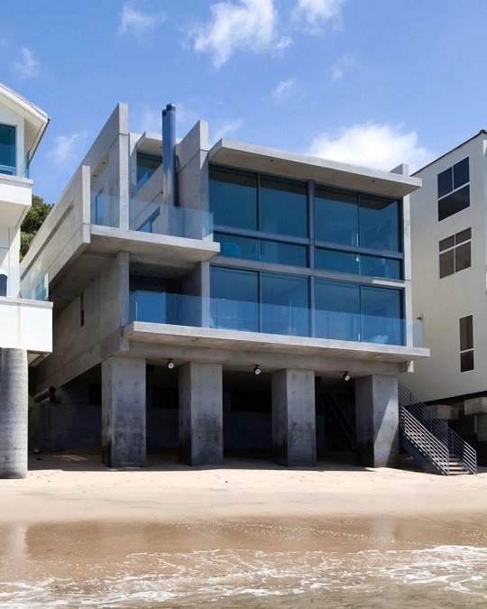 Details About Kanye West's New $57 Million Concrete Mansion on Malibu Beach Designed by Tadao Ando Are Incredible. Kanye West purchases $57 Million Malibu Beach Mansion designed by Pritzker Prize winning architect Tadao Ando. Kanye West Malibu Beach Mansion photos.