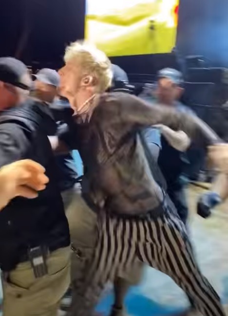 Video of Machine Gun Kelly Fight on Stage at Louder than Life 2021: Machine Gun Kelly Sucker Punches Man at Louder Than Life 2021 Festival. Machine Gun Kelly punches fan at Louder than Life Festival 2021. Details on fan dead from overdose at Louder than Life 2021