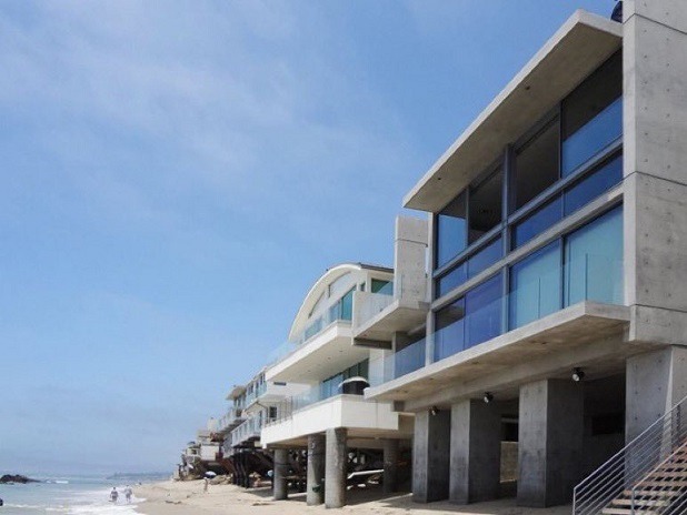 Details About Kanye West's New $57 Million Concrete Mansion on Malibu Beach Designed by Tadao Ando Are Incredible. Kanye West purchases $57 Million Malibu Beach Mansion designed by Pritzker Prize winning architect Tadao Ando. Kanye West Malibu Beach Mansion photos.
