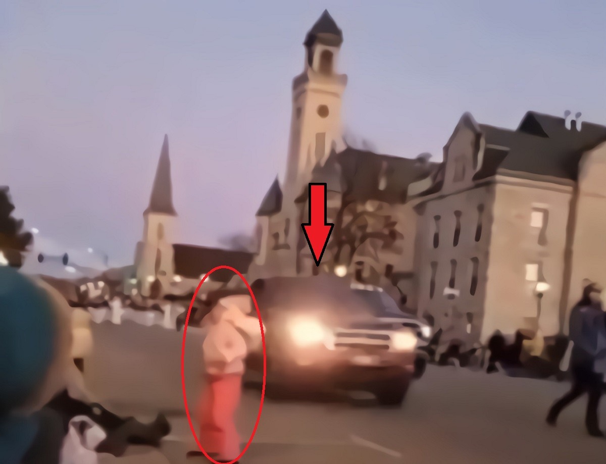 Video Shows Waukesha Parade Speeding Red SUV Barely Missing Child Wearing Pink Before Running 23 People Over. Video Shows Speeding Red SUV Barely Missing Kid Wearing Pink at Waukesha Parade Before Running Over 23 People. Video of Red SUV driving through Waukesha Parade. Red SUV almost hitting kid wearing pink at Waukesha Parade.