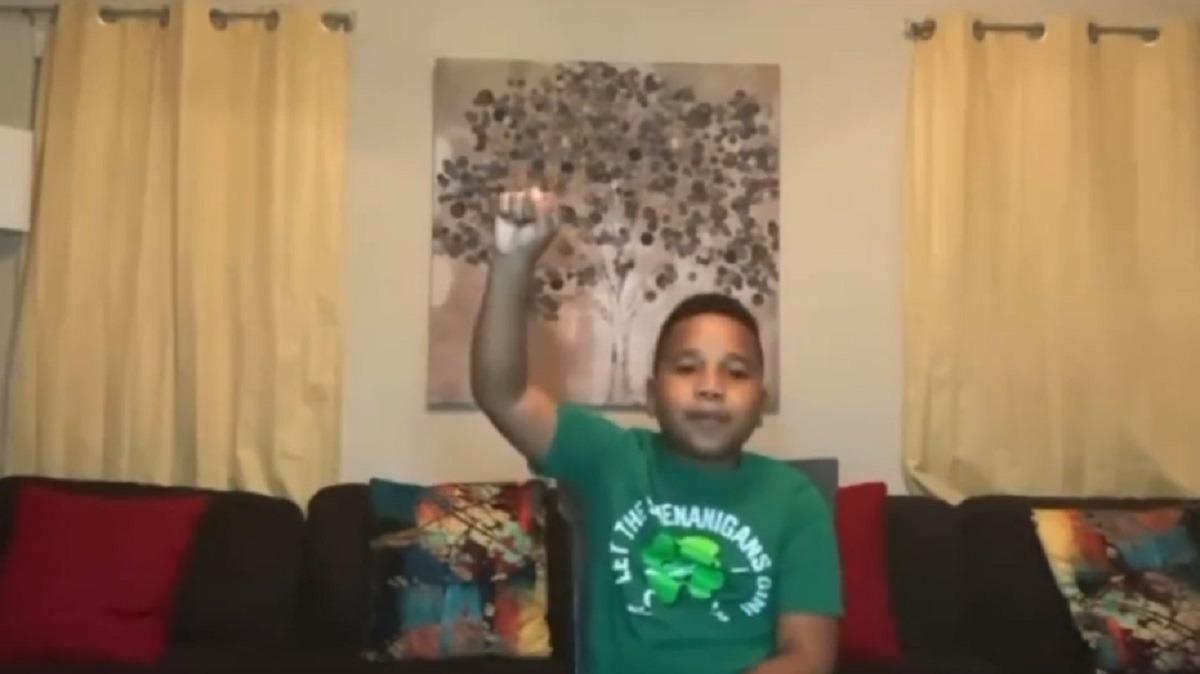 Young Kid chase_man2littt 'No More Homework' Rant Against Teachers Giving Homework Goes Viral. Kid goes on 'no more homework' rant and puts fist up in the air like activist.