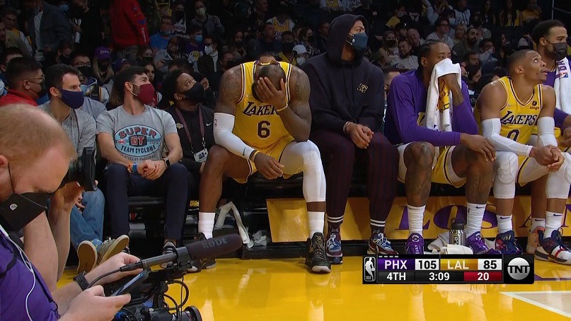 Lebron James crying on Lakers bench during Loss to Suns. Lebron James face palm gesture during Lakers vs Suns. Lebron James depressed on Lakers bench during Suns blowout win.
