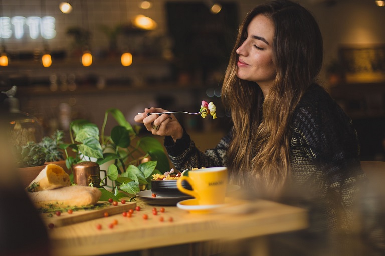 a woman masturdating at local food place.