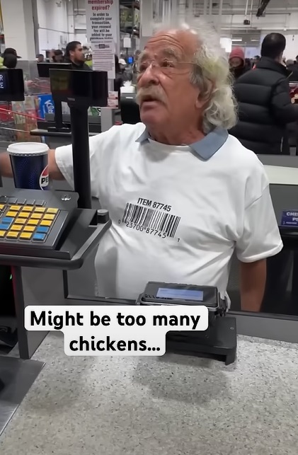 Man proving the Costco chicken shirt lifehack actually works.