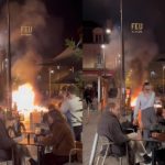 People in France Calmly Eating in Front Massive Protest Fire Sparks 'This is Fine' Meme Comparisons