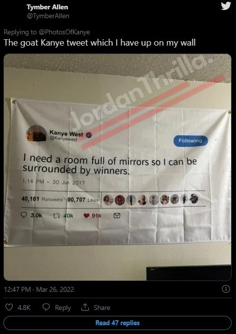 Man's Kanye West tweet poster hanging in room.