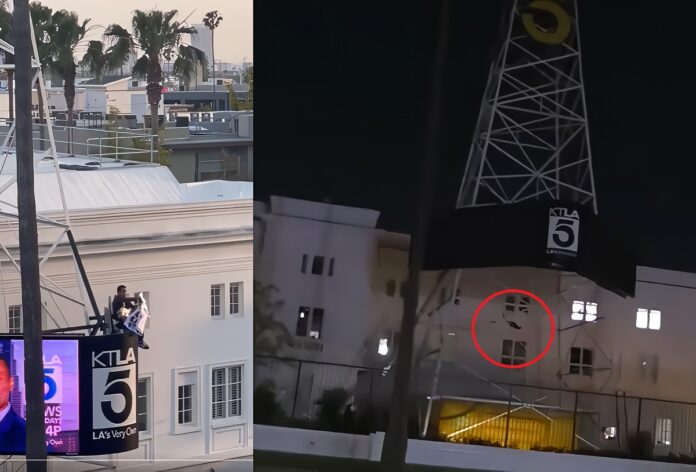 ktla-tower-man-with-mk-ultra-free-billie-eilish-sign