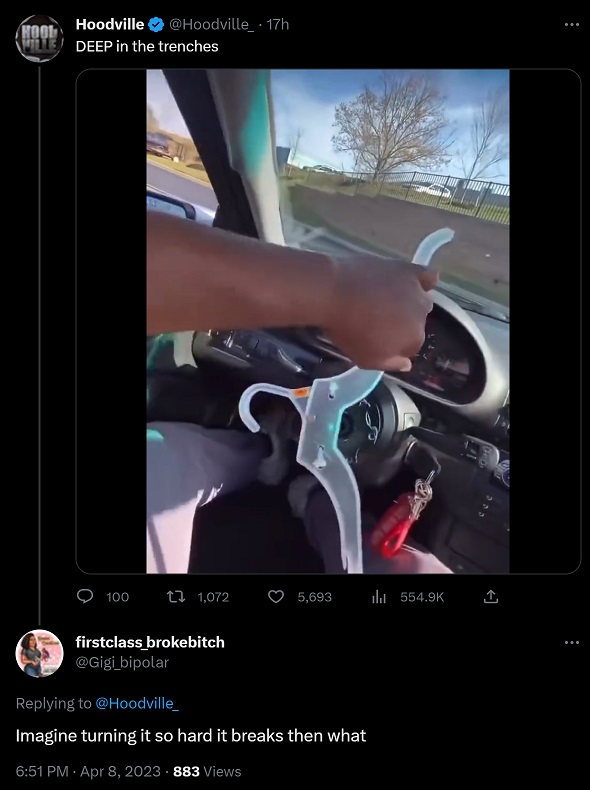 Man Using Plastic Hanger as Steering Wheel