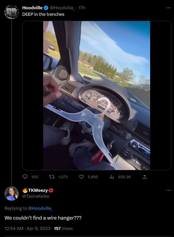 Man Using Plastic Hanger as Steering Wheel