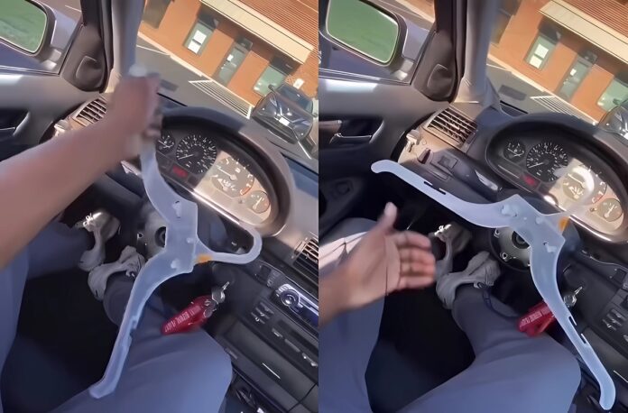 man-using-hanger-as-steering-wheel-5