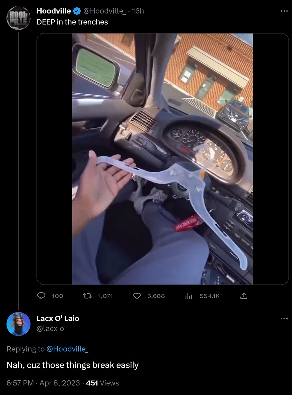 Man Using Plastic Hanger as Steering Wheel