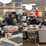 White Waffle House Employee Blocking Chair Throw with One Arm During Christmas Fight Video Trends with Job Training
