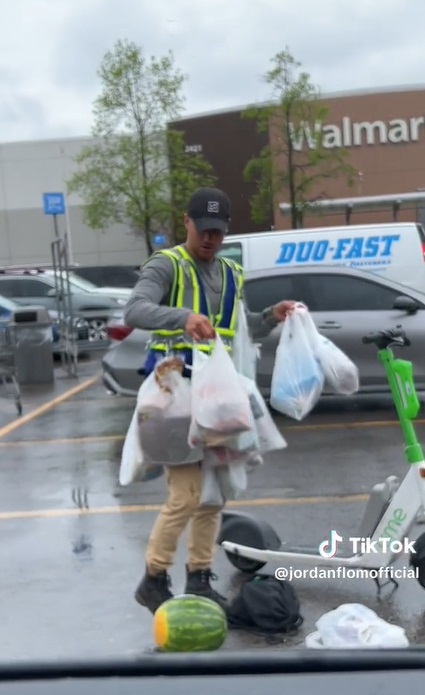 Walmart Customer Using Lime Electric Scooter to Carry All His Bags and Giant Watermelon in the Rain Goes Viral