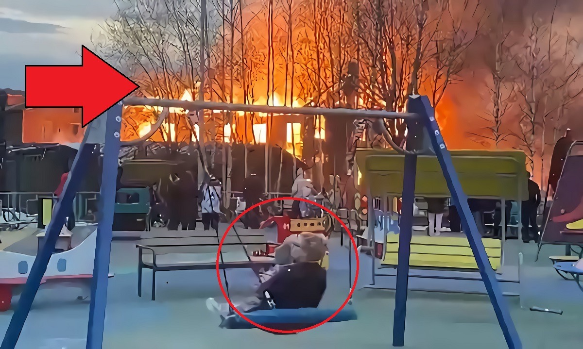 Video Shows Russians Watching House Burning in Kotlas Russia While Playing on Playground with Kids
